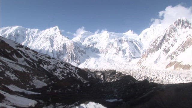 Majestic Spantik Gold Peak Under Sunlight