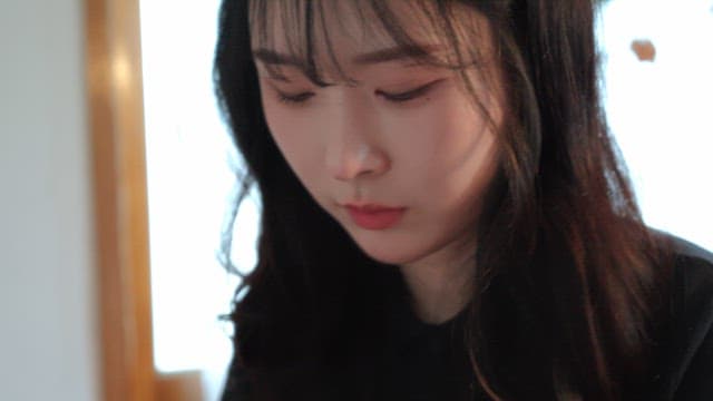 Young woman focused indoors