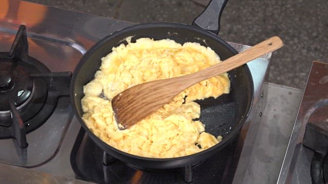 Scrambled Eggs Cooking with Pumpkins in a Frying Pan