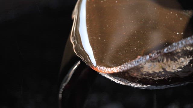 Pouring traditional brown fermented soy sauce