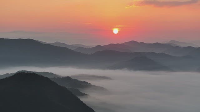 Majestic Sunrise Over Misty Mountains