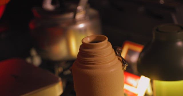 Hot Tea Poured into a Thermos