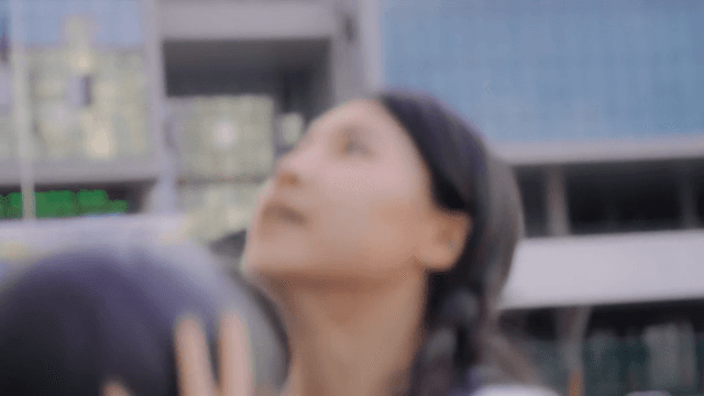 Woman smiling while playing basketball
