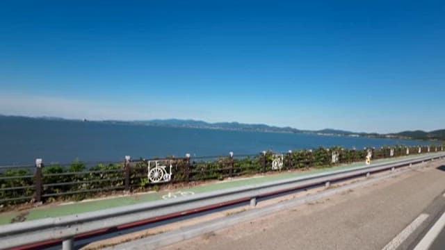 Camping Car Running on a Coastal Road on a Sunny Day