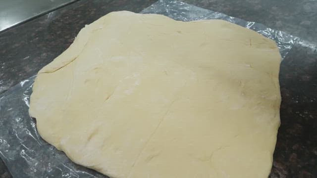 Chef preparing dough with precision