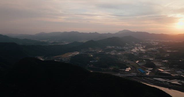 Rural Sunset Landscape with River and Road