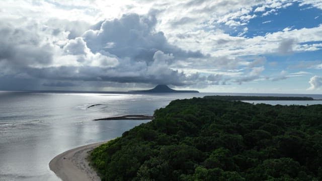 Sea with islands covered in lush forests
