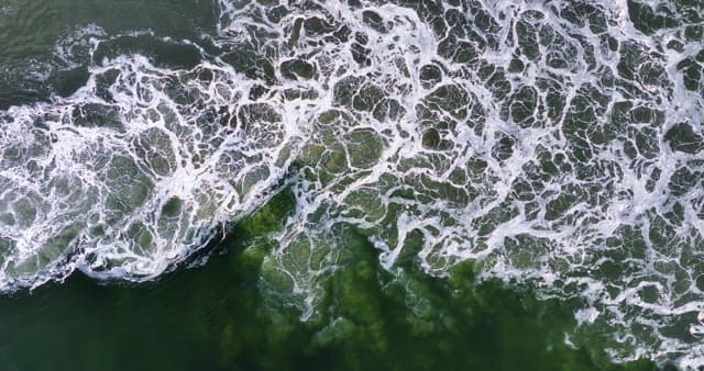 Waves crashing on the ocean surface