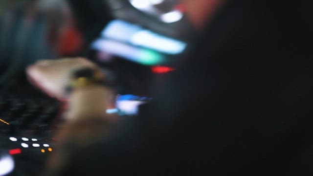 DJ Performing in front of a Crowd at a Club
