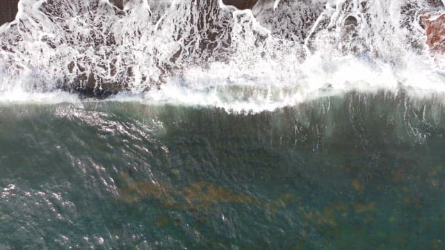 Waves crashing on a sandy beach