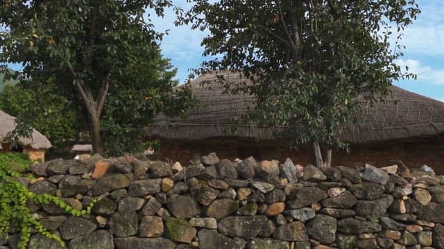 Traditional Stone Fences and Thatched Roof Houses