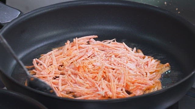 Carrot Pancakes Cooked on an Oiled Frying Pan