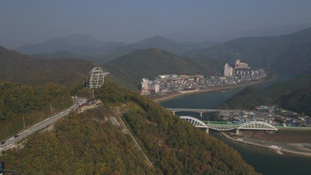 Scenic Skywalk Overlooking a Riverside Village