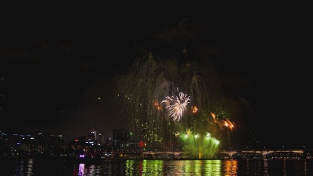 Nighttime Fireworks Display over the Cityscape