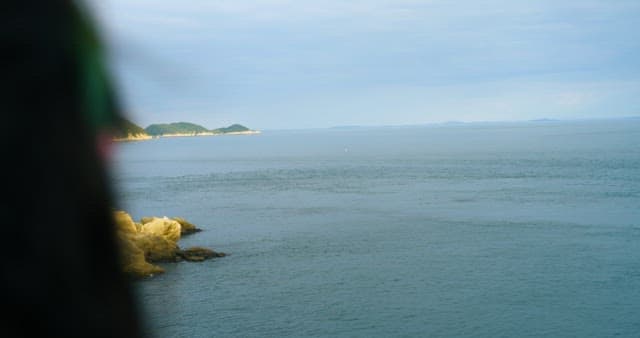 Calm and Tranquil Sea and a Blurry Horizon in the Distance