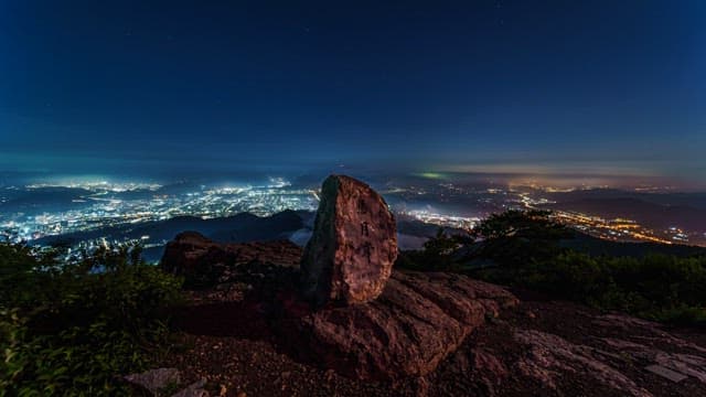 Night View over the City from the Mountaintop with Stone