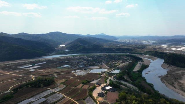 Rural village surrounded by farmland and river