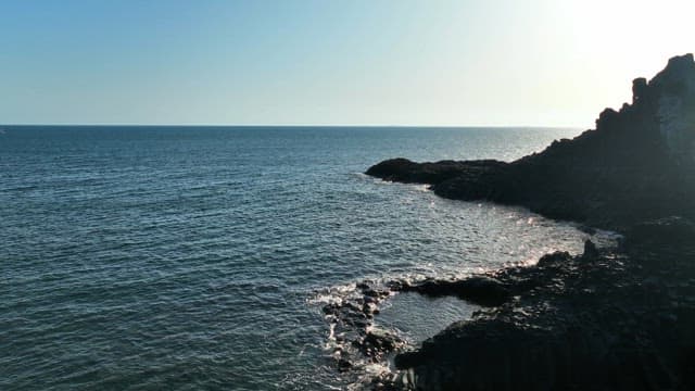 Rocky coastline with sparkling sea