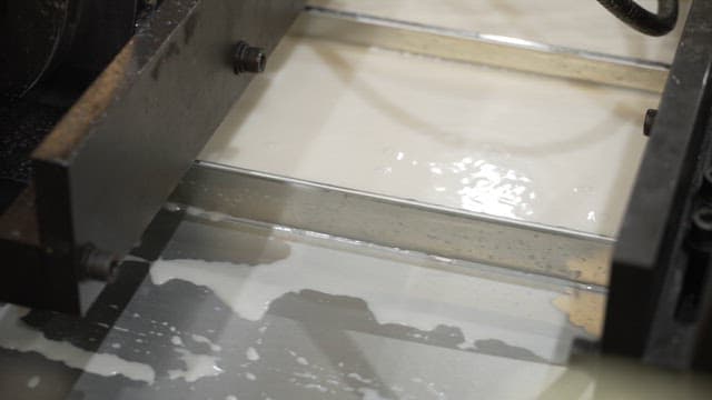 Liquid material flowing through machinery