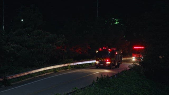 Fire Truck and Ambulance Crossing the Road at Night