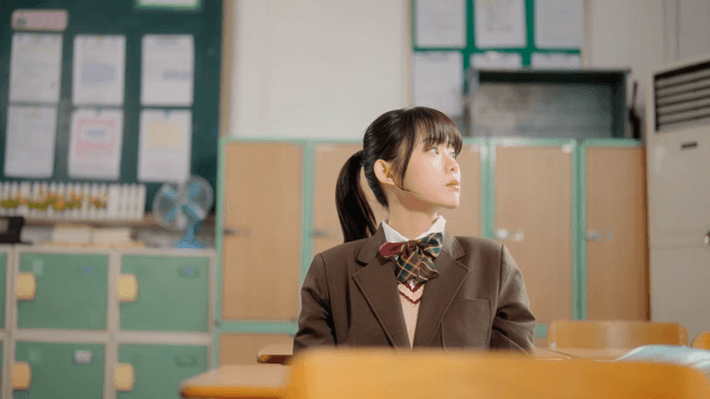 Student resting in a classroom