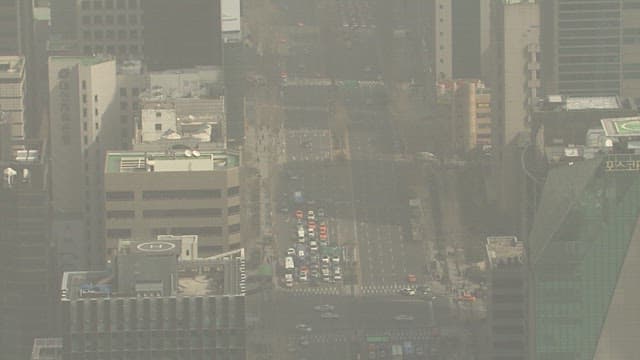 Hazy Aerial View of Busy City Intersection