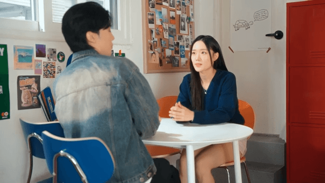 Couple sitting at a table in a pizza shop