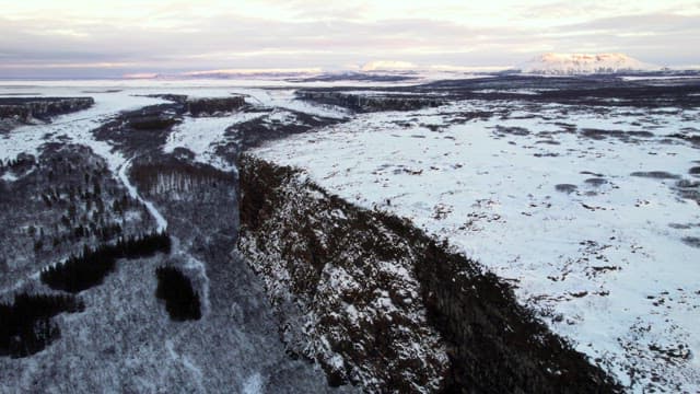 Snow-covered cliffs and vast landscape