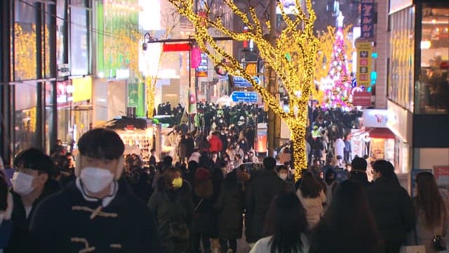 Bustling Nighttime Street Scene Lit by Decorative Lights