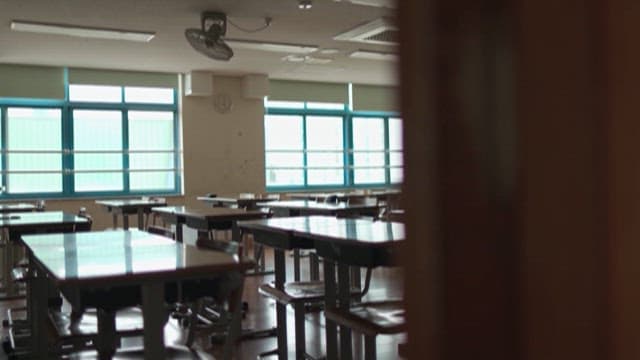 Empty Classroom with Sunlight and Desks