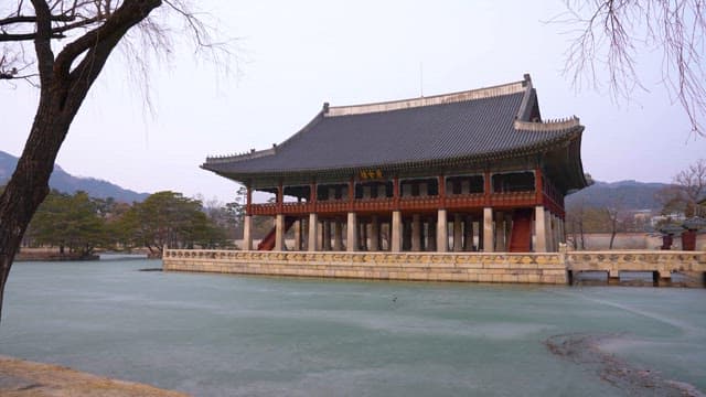 Traditional Korean pavilion on a frozen lake