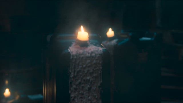Candles Burning in a Dimly Lit Space