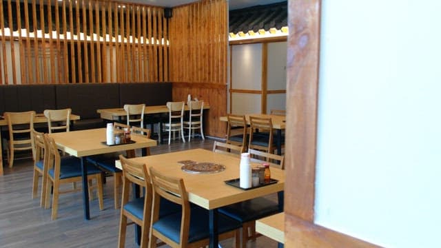 Quiet interior of restaurant with charming traditional wooden design