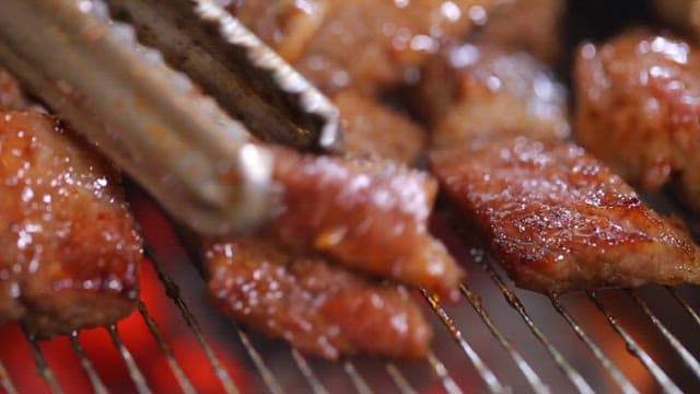 Grilled Pork Ribs Sizzling on a Grill