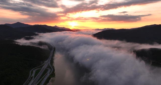 Sunrise over mountains with clouds