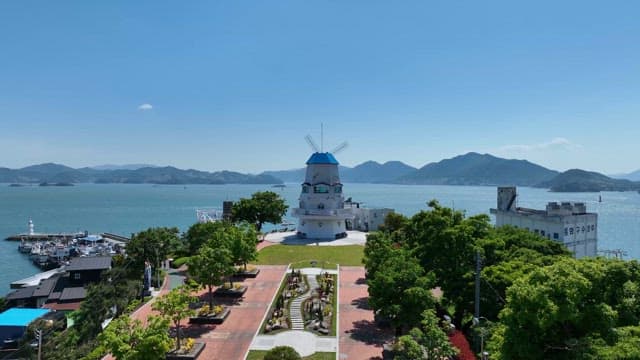 Scenic coastal view with a windmill