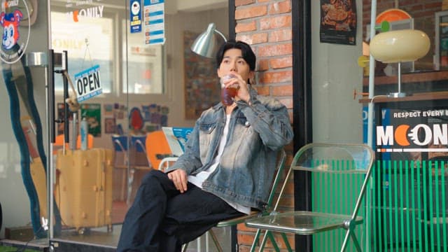 Young man relaxing and drinking coffee