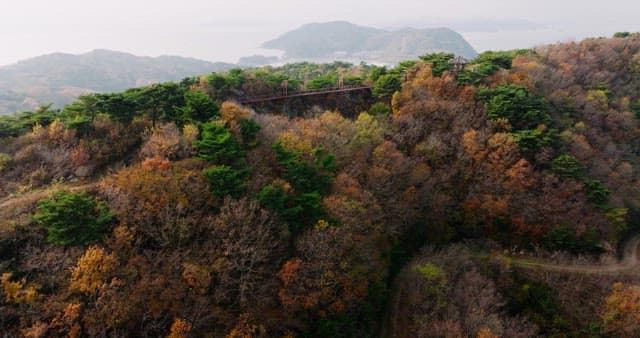 Sky Bridge Hanging Between Autumn Mountains