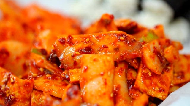 Chungmu gimbap on a white plate