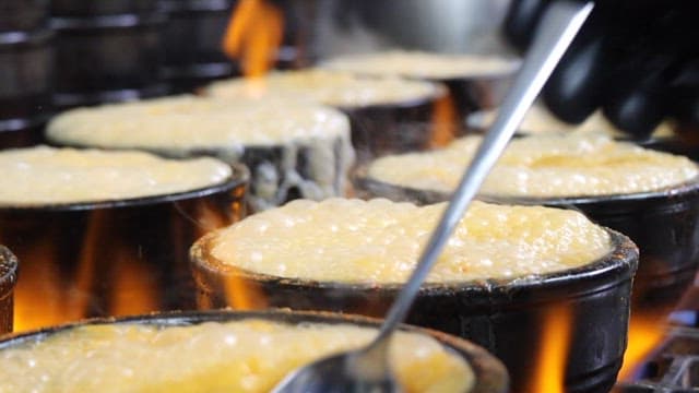 Earthen Pot Dishes Boilling in a Restaurant Kitchen