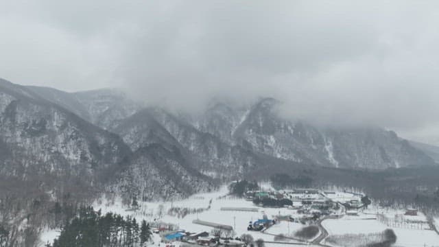 Snowy Mountain Landscape with Village