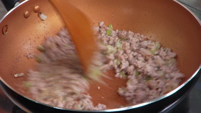 Stirring Ground Meat and Vegetables in a Pan