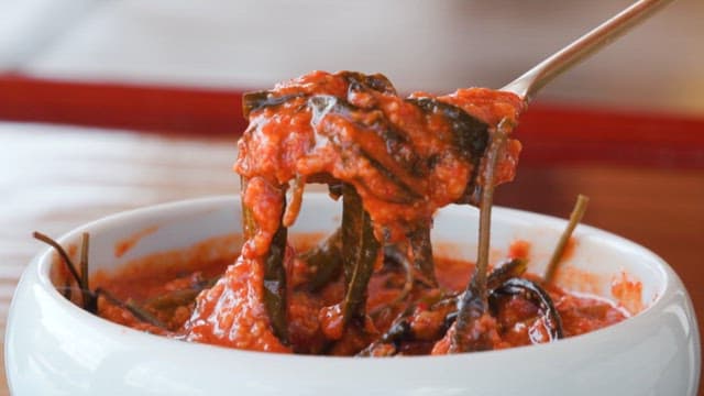 Spoonful of sweet and sour soybean paste in a bowl