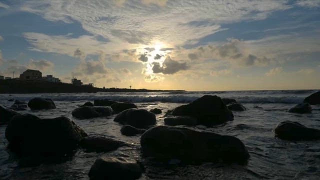 Seascape with cloudy sky at dusk
