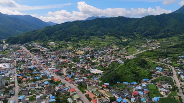 Small town surrounded by lush mountains