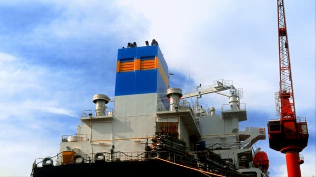 Shipyard with Cranes and Docked Vessel