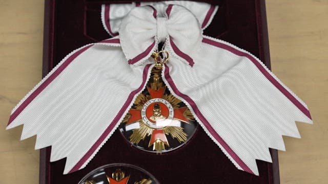 Close-up view of a prestigious Order of Culture with ribbon