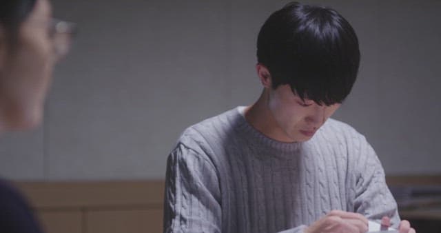 Man opening a paper envelope