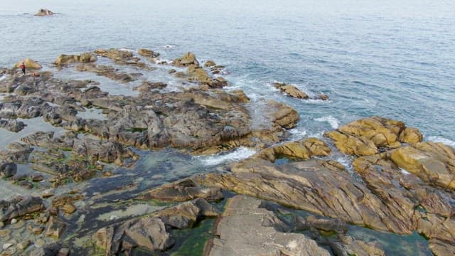 Rocky shoreline with waves crashing