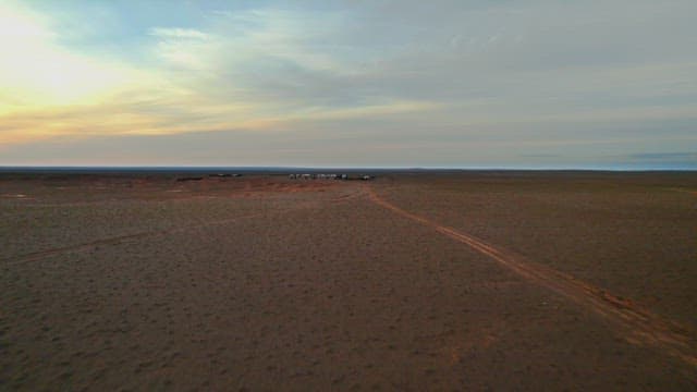 Nomadic Campsite at Dusk in Arid Landscape
